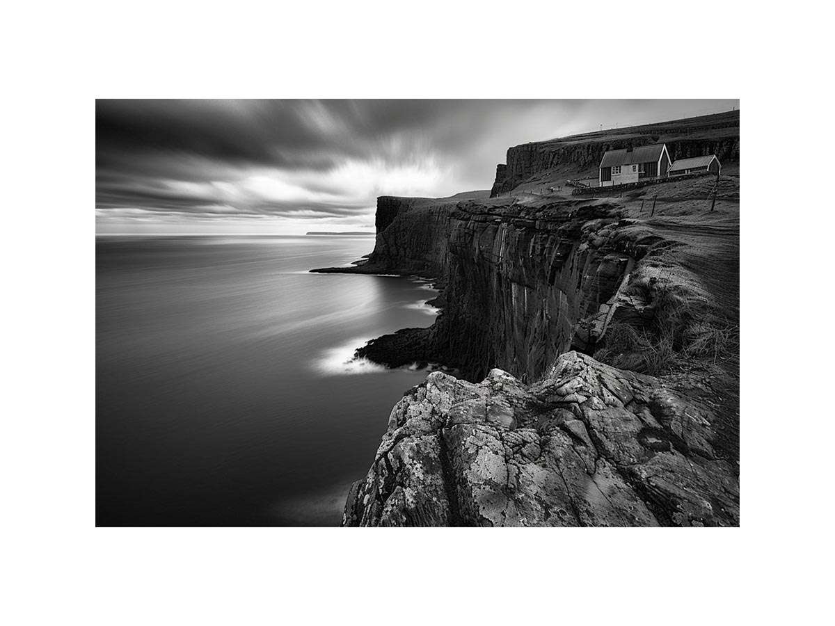 Black and white coastal cliff photography for modern living room decor.