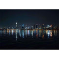 Night city skyline artwork with reflections for modern office decor.