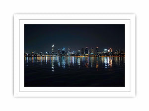 Night city skyline artwork with reflections for modern office decor.