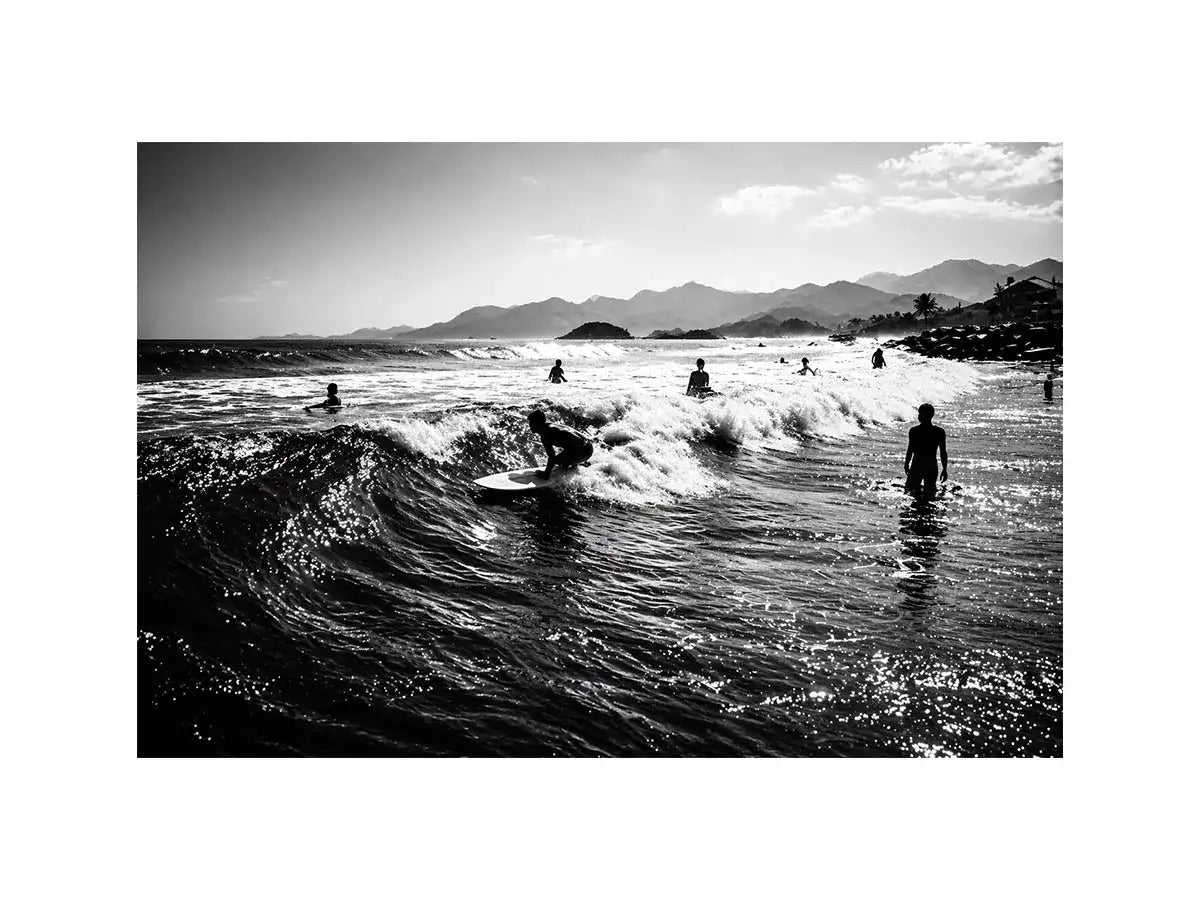 black and white surfing wave with surfers ocean wall art canvas
