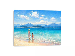 serene beach scene with woman and child ocean wall art canvas