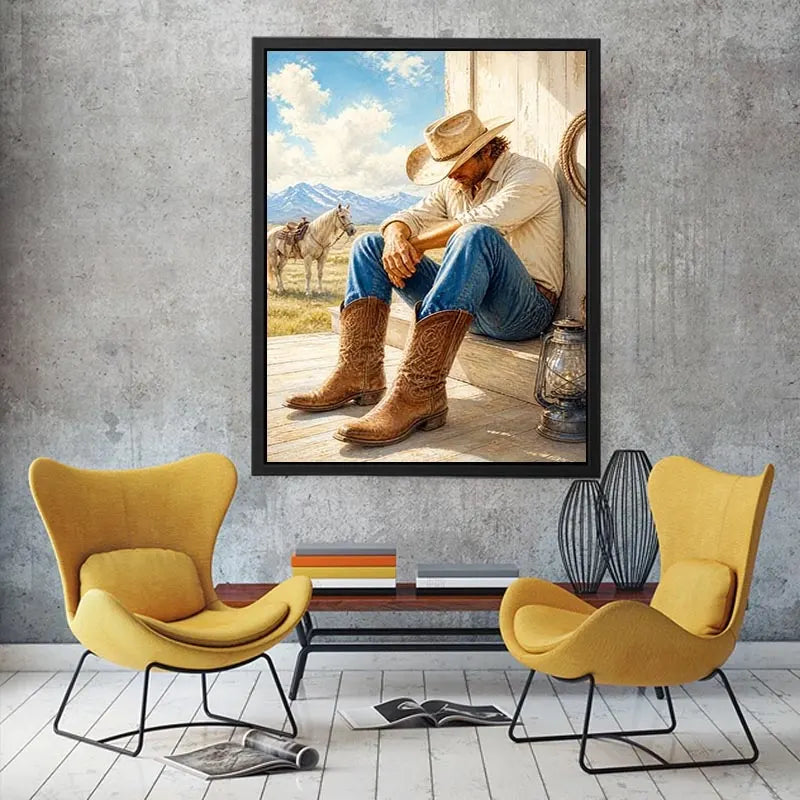 Rustic cowboy wall art featuring a thoughtful rancher in leather boots beside a white horse with mountain scenery and warm countryside textures in a timeless western painting.