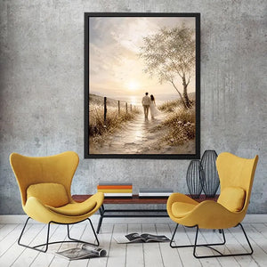 Romantic coastal wall art featuring a couple walking along a sunlit beach path with golden skies, ocean views, and soft wildflower scenery in a dreamy landscape painting.