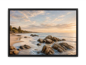 Rocky beach coastal wall art with golden sunset light, textured ocean waves, and serene shoreline landscape canvas for modern coastal interiors