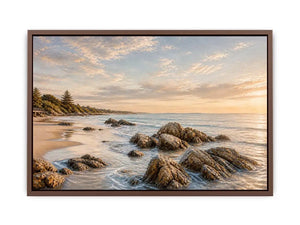 Rocky beach coastal wall art with golden sunset light, textured ocean waves, and serene shoreline landscape canvas for modern coastal interiors