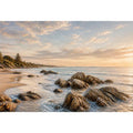 Rocky beach coastal wall art with golden sunset light, textured ocean waves, and serene shoreline landscape canvas for modern coastal interiors