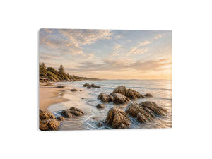 Rocky beach coastal wall art with golden sunset light, textured ocean waves, and serene shoreline landscape canvas for modern coastal interiors