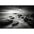 Black and white ocean wall art with dramatic coastal rocks, misty waves, and moody storm clouds in contemporary monochrome seascape style
