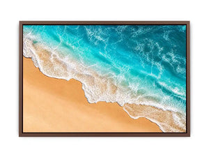 Aerial beach canvas print with aqua ocean waves for coastal living room decor.