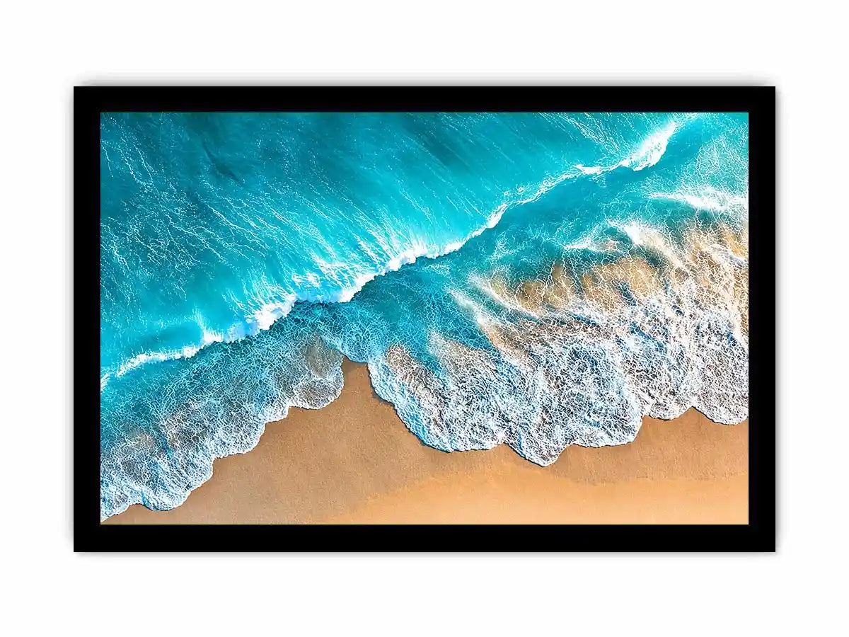 Aerial turquoise ocean beach canvas print with white foamy waves washing over sandy shore and tropical coastal water view