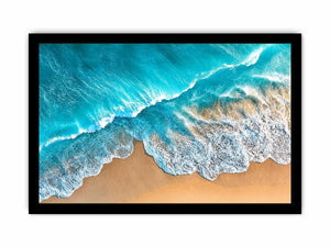 Aerial turquoise ocean beach canvas print with white foamy waves washing over sandy shore and tropical coastal water view