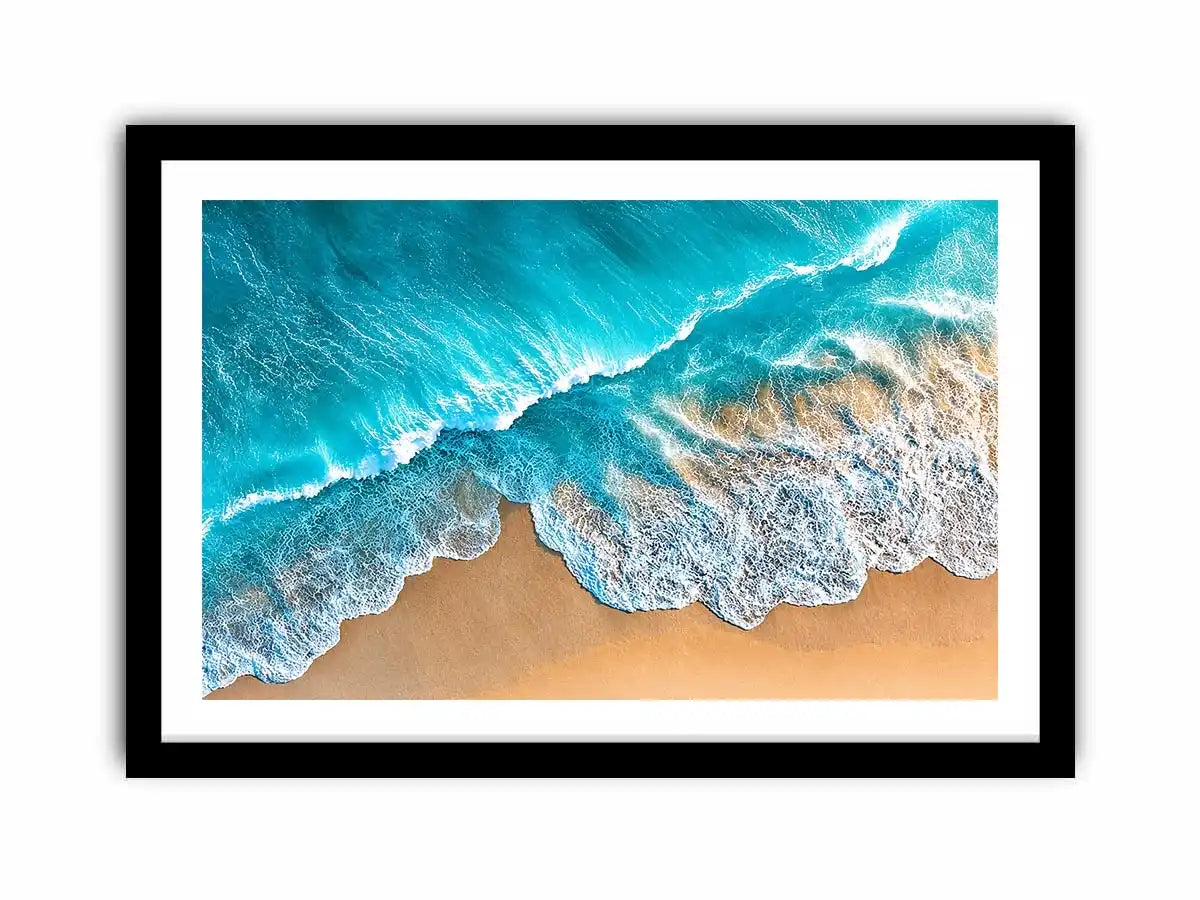 Aerial turquoise ocean beach canvas print with white foamy waves washing over sandy shore and tropical coastal water view