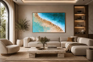 Aerial beach canvas art with turquoise water and walking figures for coastal living room decor.