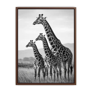 Vertical black and white giraffe family canvas art for hallway decor.