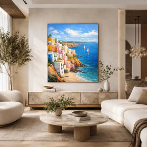 Vertical Mediterranean cliffside village canvas art with blue ocean for coastal decor.
