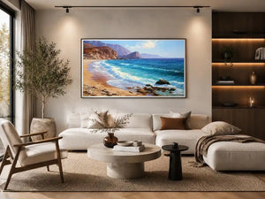 Coastal beach canvas art with blue waves and cliffs for relaxed living room decor.
