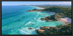 Panoramic coastal canvas art with turquoise ocean, rocky headlands, and beach scenery for modern living room decor.
