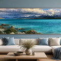Teal alpine lake canvas print with snow mountains and dramatic clouds for refined living room or bedroom decor.