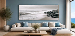 Neutral black and white coastal canvas art with rocks for calming bedroom decor.