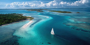 Turquoise island sailboat canvas art for luxury coastal living room decor.