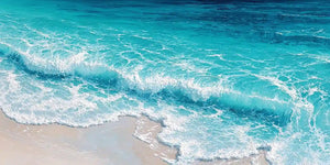 Close-up turquoise wave canvas art for coastal modern living room decor.