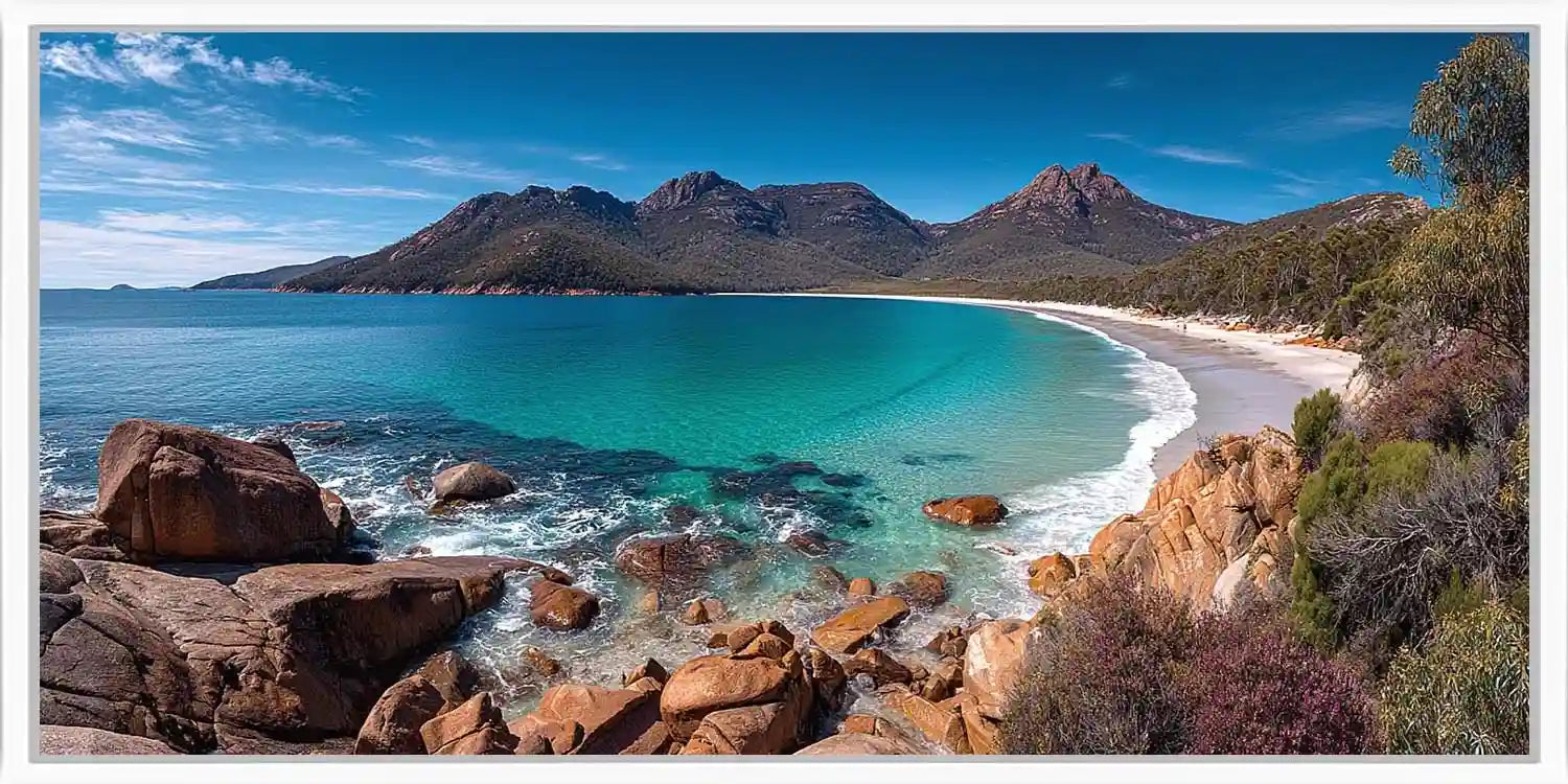 Turquoise coastal bay canvas art with mountains for modern beach house decor.