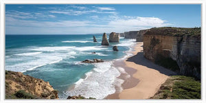 Dramatic coastal cliff canvas art with ocean waves for modern living room decor.