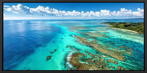 Aerial coral reef canvas art for tropical coastal office decor.