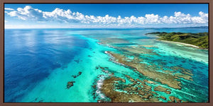 Aerial coral reef canvas art for tropical coastal office decor.