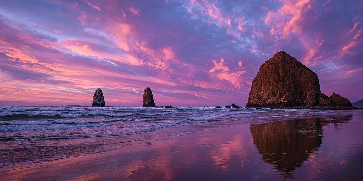 Purple sunset seastack canvas art for dramatic coastal living room decor.