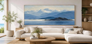 Blue mountain lake canvas art with island, snowy peaks and peaceful water.