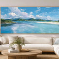 Turquoise lagoon canvas art with white sand, green hills and bright tropical sky.