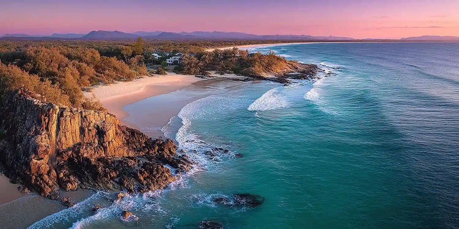 Panoramic coastal sunset canvas art with turquoise ocean for luxury interiors.