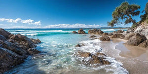 Tropical beach canvas art with pandanus tree and ocean waves for coastal decor.
