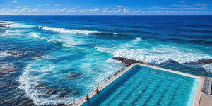 Coastal ocean pool canvas art with blue waves for modern beach house decor.