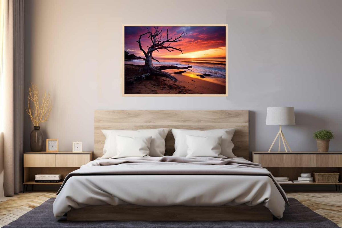 Driftwood tree on beach at glowing sunset for warm coastal living room wall art.