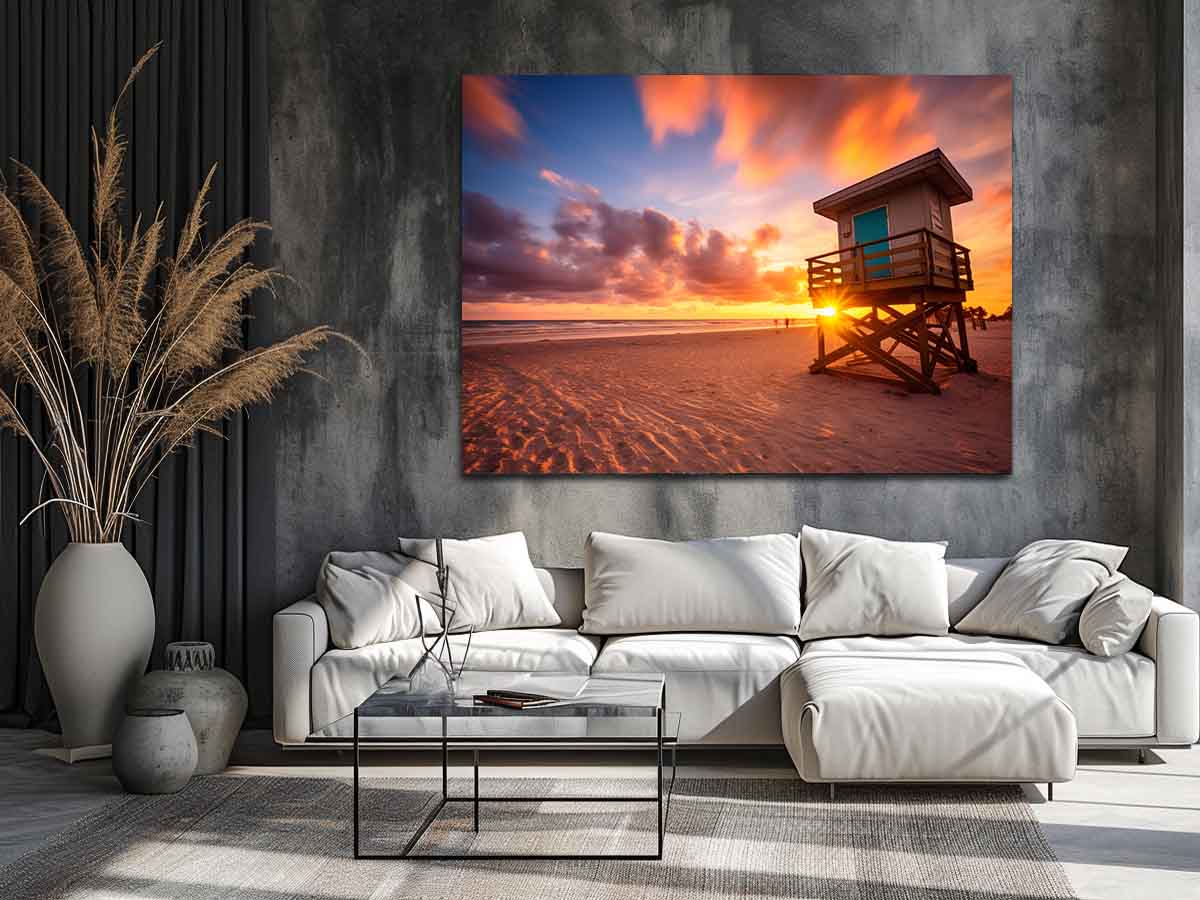 Beach sunset lifeguard wall art with warm sky for coastal bedroom decor.
