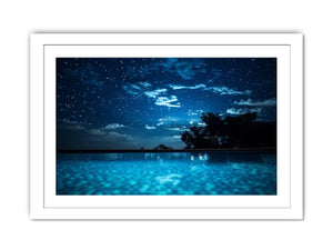 Celestial Pool Night star filled night sky above glowing turquoise pool water for modern home decor.