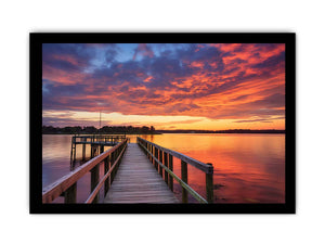 Sunset jetty canvas print with glowing water for modern living room decor.