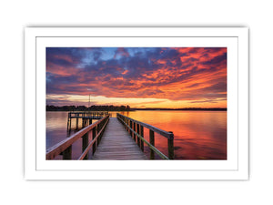 Sunset jetty canvas print with glowing water for modern living room decor.