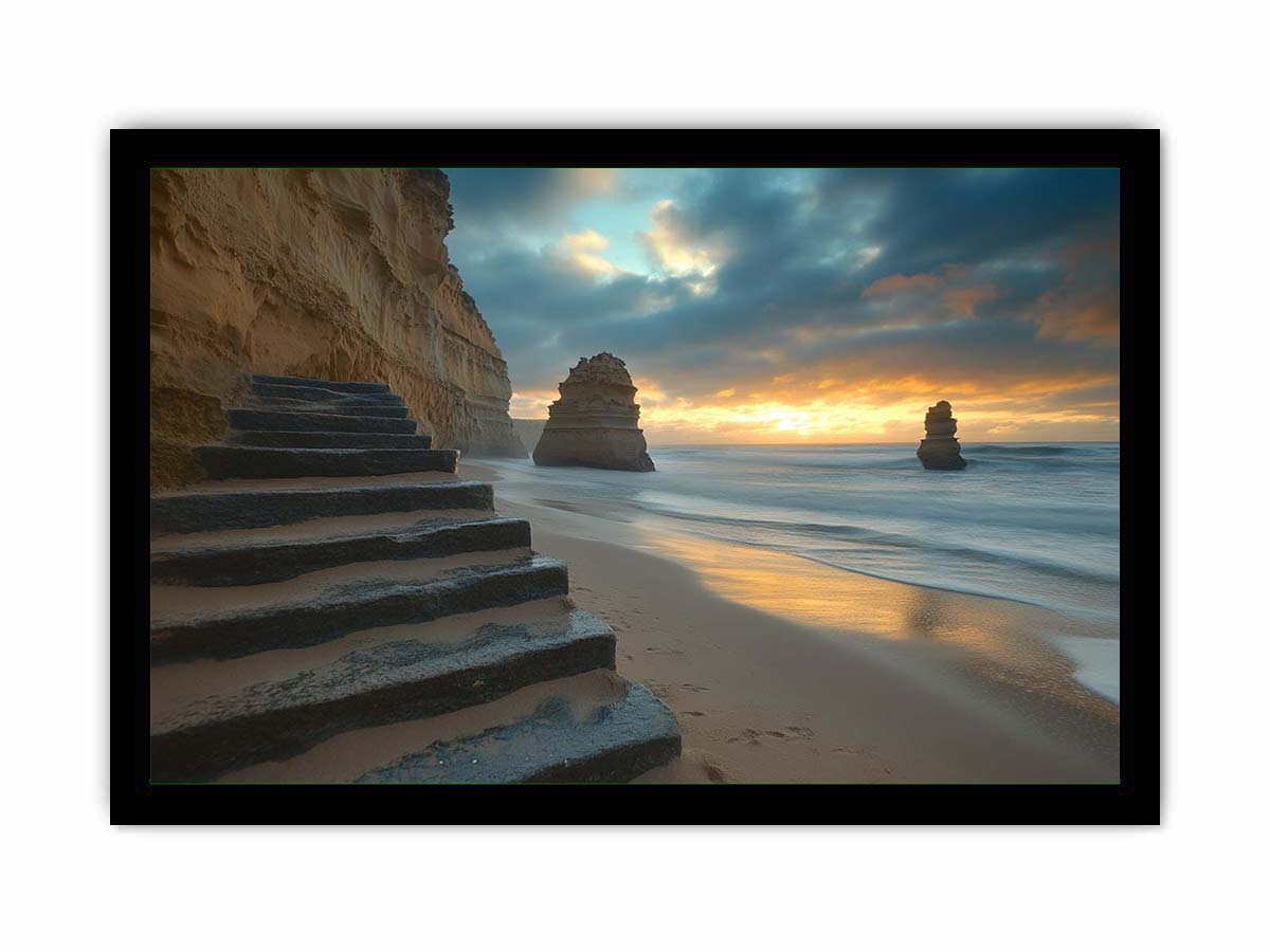 Moody coastal beach photograph with cliffs and stairs for luxury decor.