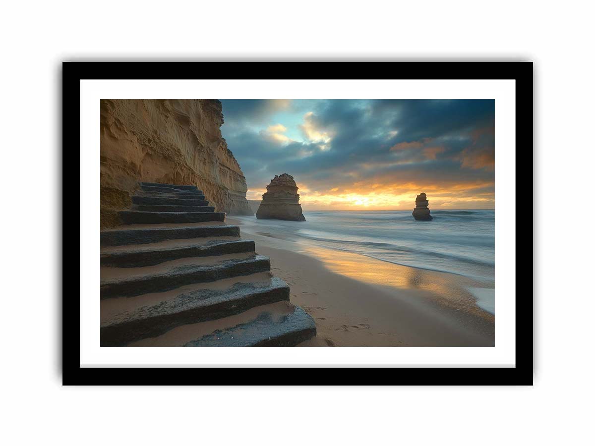 Moody coastal beach photograph with cliffs and stairs for luxury decor.
