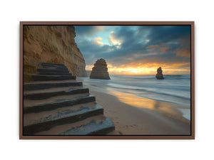 Moody coastal beach photograph with cliffs and stairs for luxury decor.
