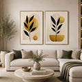 Black and gold botanical diptych canvas art for modern living room decor.