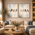 Watercolor birds on a wire canvas art with soft blue sky for peaceful home decor.