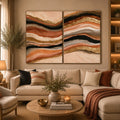 Terracotta abstract canvas art with black and gold flowing bands for modern living rooms.