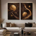 Black and gold celestial abstract canvas art with moon orbs for luxury living room decor.