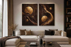 Black and gold celestial abstract canvas art with moon orbs for luxury living room decor.