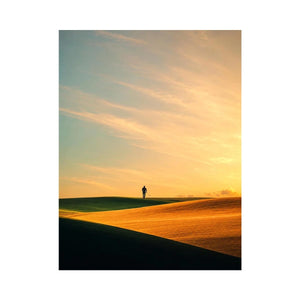 Lone figure desert canvas art with surreal warm tones for modern hallway decor.