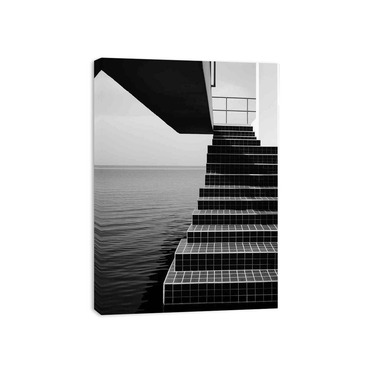 Black and white architectural stairway canvas art beside the sea for modern office decor.